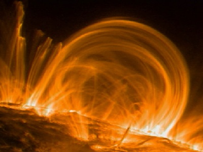 The outermost layer of the <a href="/sun/solar_atmosphere.html&edu=high">Sun's atmosphere</a> is the <a href="/sun/atmosphere/corona.html&edu=high">corona</a>.  The corona is very, very hot - about 1 million degrees!  Glowing <a href="/sun/Solar_interior/Sun_layers/Core/plasma_state.html&edu=high">plasma</a>, which is like magnetized gas, sometimes forms loops in the corona. <a href="/sun/atmosphere/sunspot_magnetism.html&edu=high">Magnetic fields around sunspots</a> make these loops, called coronal loops. The loops are huge - about 30 Earths would fit across them! A satellite named TRACE took this picture in November 1999.<p><small><em>Image courtesy of NASA/Trace Mission</em></small></p>